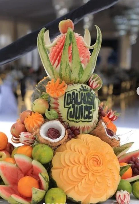 Carved watermelon and a colourful assortment of fresh fruit